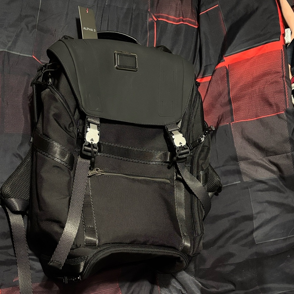 Tumi Black Backpack with Silver Buckles